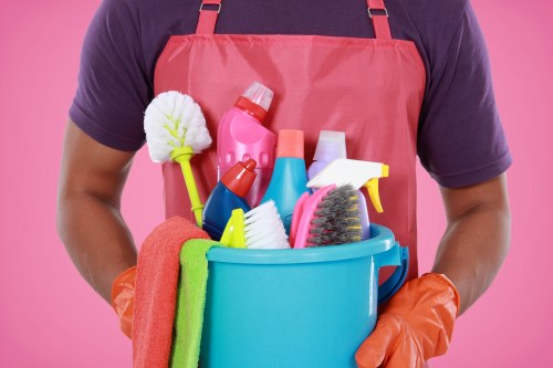 Cleaner in SW19 disinfecting a modern kitchen