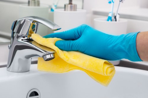 Office cleaning team in SW19 disinfecting desks and communal areas