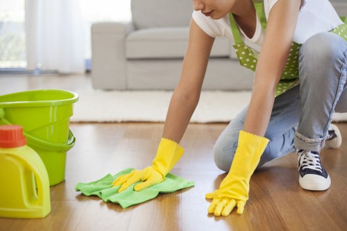 Deep cleaning kitchen surfaces during SW19 move-out cleaning